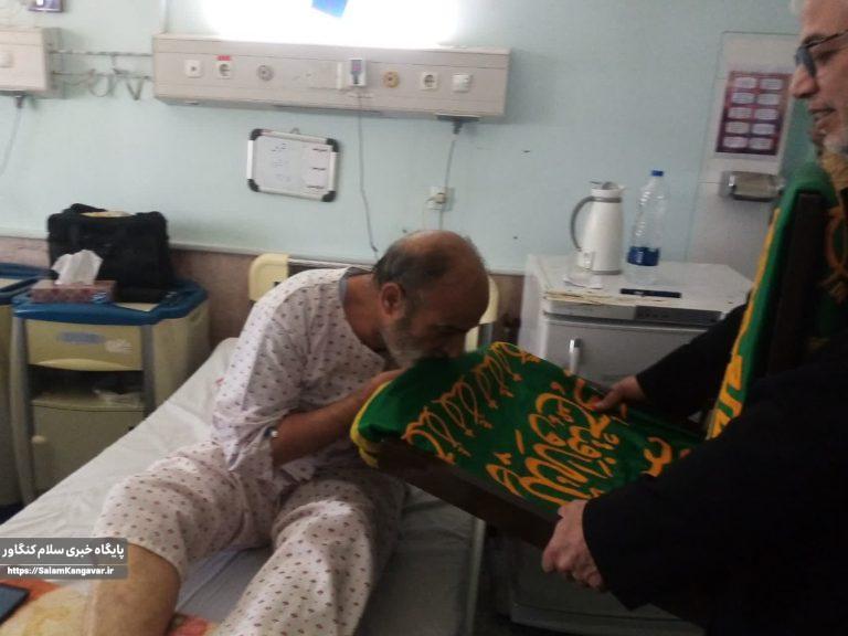 پرچم متبرک حرم مطهر رضوی بر بالین بیماران کنگاوری